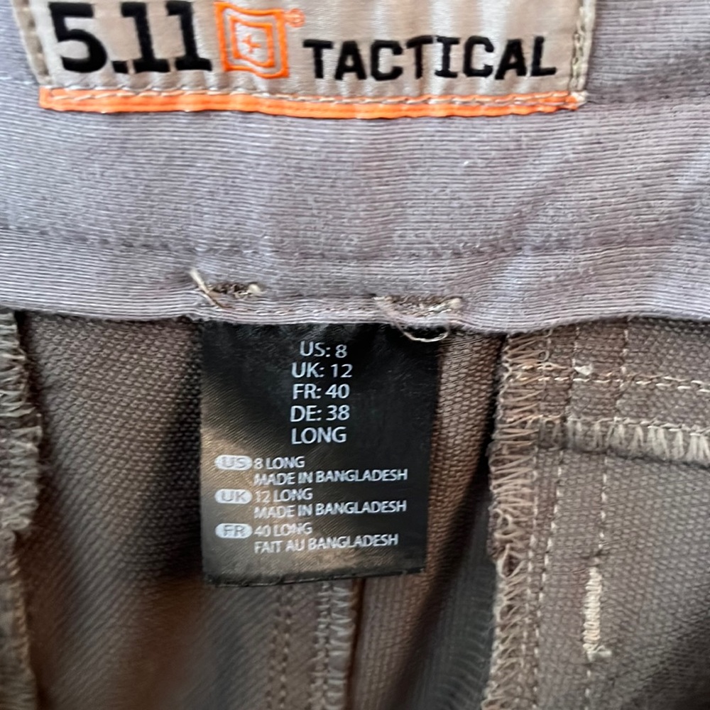 Brown 5.11 tactical pants with tear